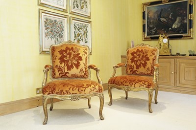 Lot 27 - A pair of French Louis XV giltwood fauteuils à la reine