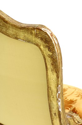 Lot 27 - A pair of French Louis XV giltwood fauteuils à la reine