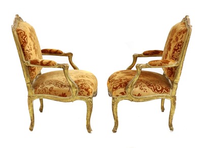 Lot 27 - A pair of French Louis XV giltwood fauteuils à la reine