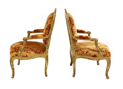 Lot 27 - A pair of French Louis XV giltwood fauteuils à la reine