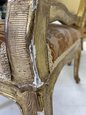 Lot 27 - A pair of French Louis XV giltwood fauteuils à la reine