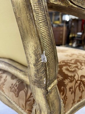 Lot 27 - A pair of French Louis XV giltwood fauteuils à la reine