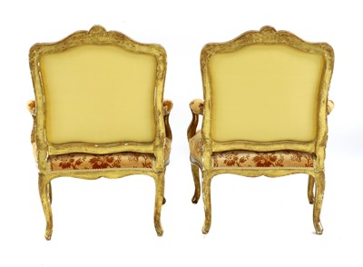 Lot 27 - A pair of French Louis XV giltwood fauteuils à la reine
