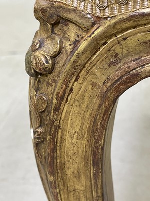 Lot 27 - A pair of French Louis XV giltwood fauteuils à la reine