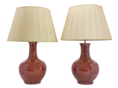 Lot 43 - A pair of Chinese-style porcelain sang-de-boeuf table lamps