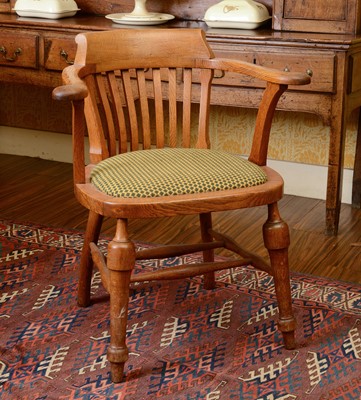 Lot 261 - An oak desk chair