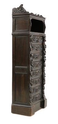 Lot 389 - A late Victorian carved ebonised oak Wellington chest of drawers