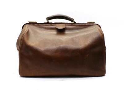 Lot 94 - A vintage crocodile suitcase with brass fittings