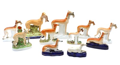 Lot 201 - Eleven Staffordshire pottery greyhounds