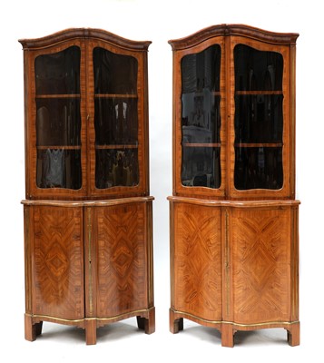 Lot 632 - A pair of French Louis XVI kingwood corner cupboards