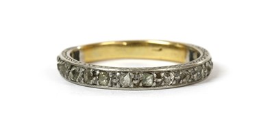 Lot 1176 - A platinum and gold diamond eternity ring