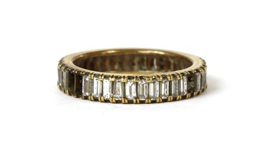 Lot 1180 - A gold diamond set full eternity ring