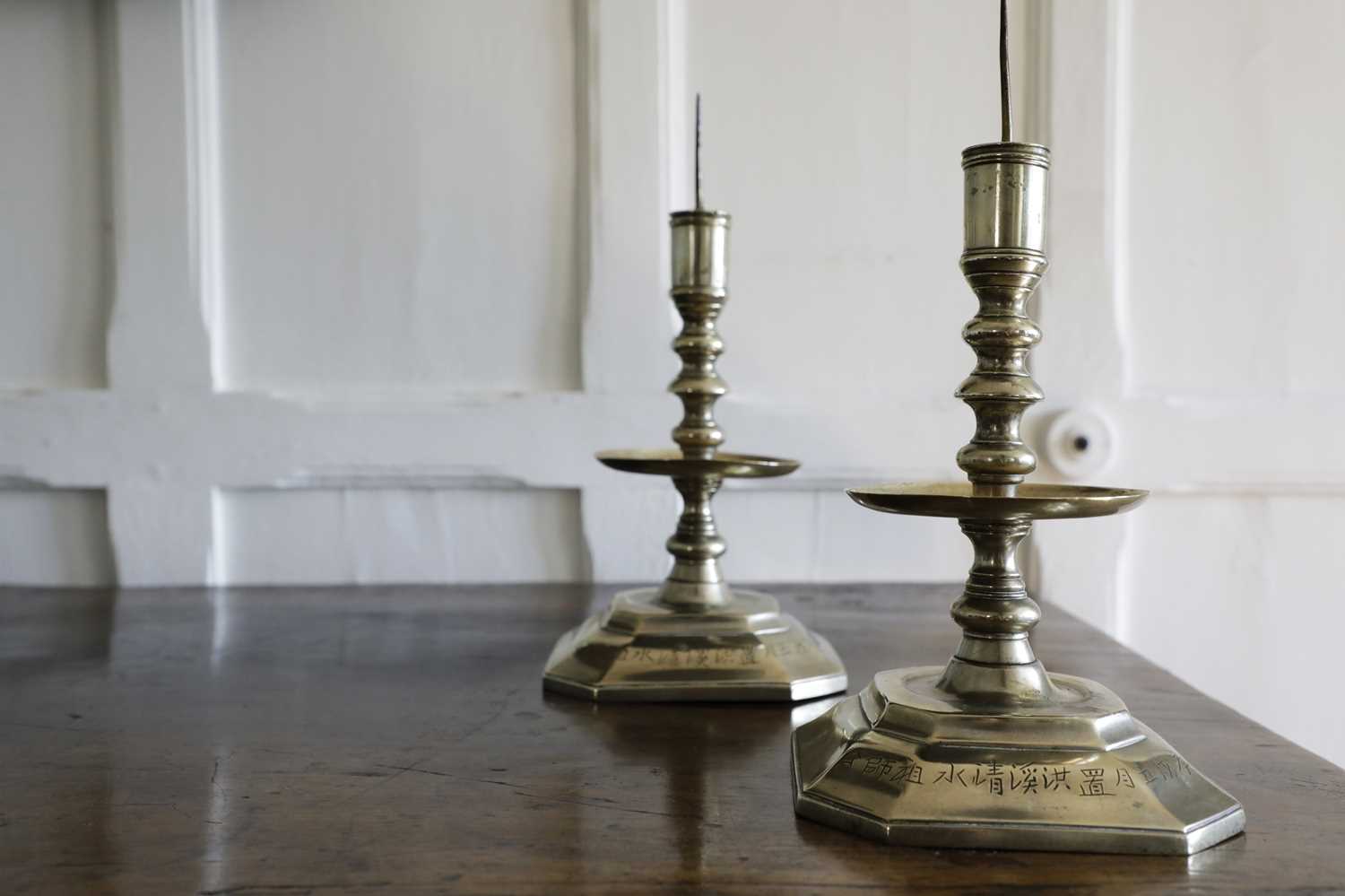 Lot 206 - A pair of Chinese paktong pricket candlesticks