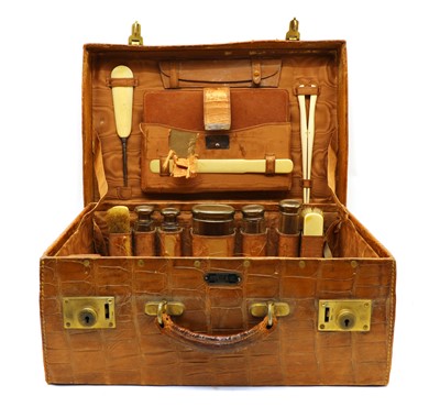 Lot 31 - An Edwardian crocodile leather vanity case
