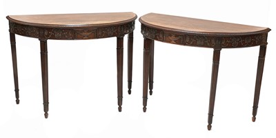 Lot 465 - A pair of Adam Revival mahogany demilune console tables