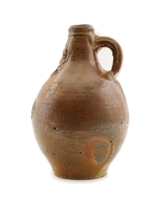Lot 126 - A stoneware bellarmine jug