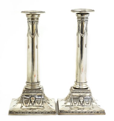 Lot 497 - A pair of Edwardian silver-plated neoclassical candlesticks