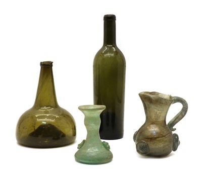 Lot 105 - An 18th century green glass bottle