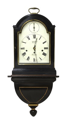 Lot 598 - An ebonised musical bracket clock and bracket