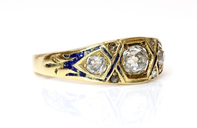 Lot 40 - A Victorian three stone graduated diamond and enamel ring, c.1860