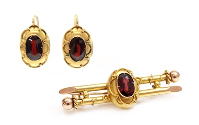 Lot 167 - A Russian gold garnet set brooch and earrings suite