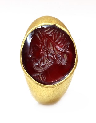 Lot 7 - A Roman hollow gold hardstone intaglio ring