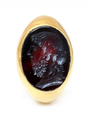 Lot 4 - A Roman hollow gold hardstone intaglio ring