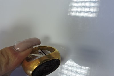 Lot 4 - A Roman hollow gold hardstone intaglio ring