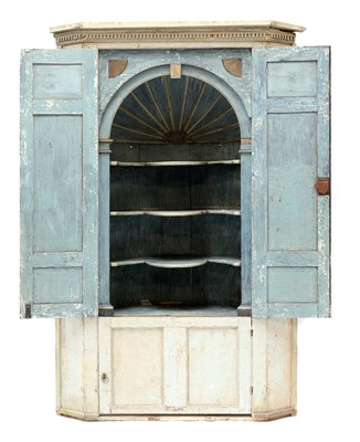 Lot 674 - A large George III painted pine corner cupboard