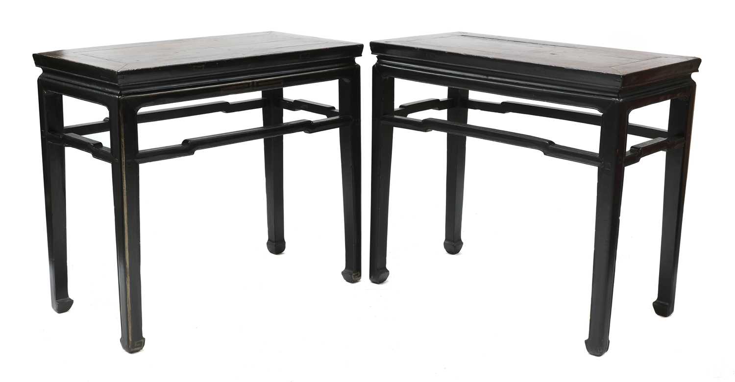 Lot 489 - A pair of Chinese ebonised and parcel-gilt hardwood low tables