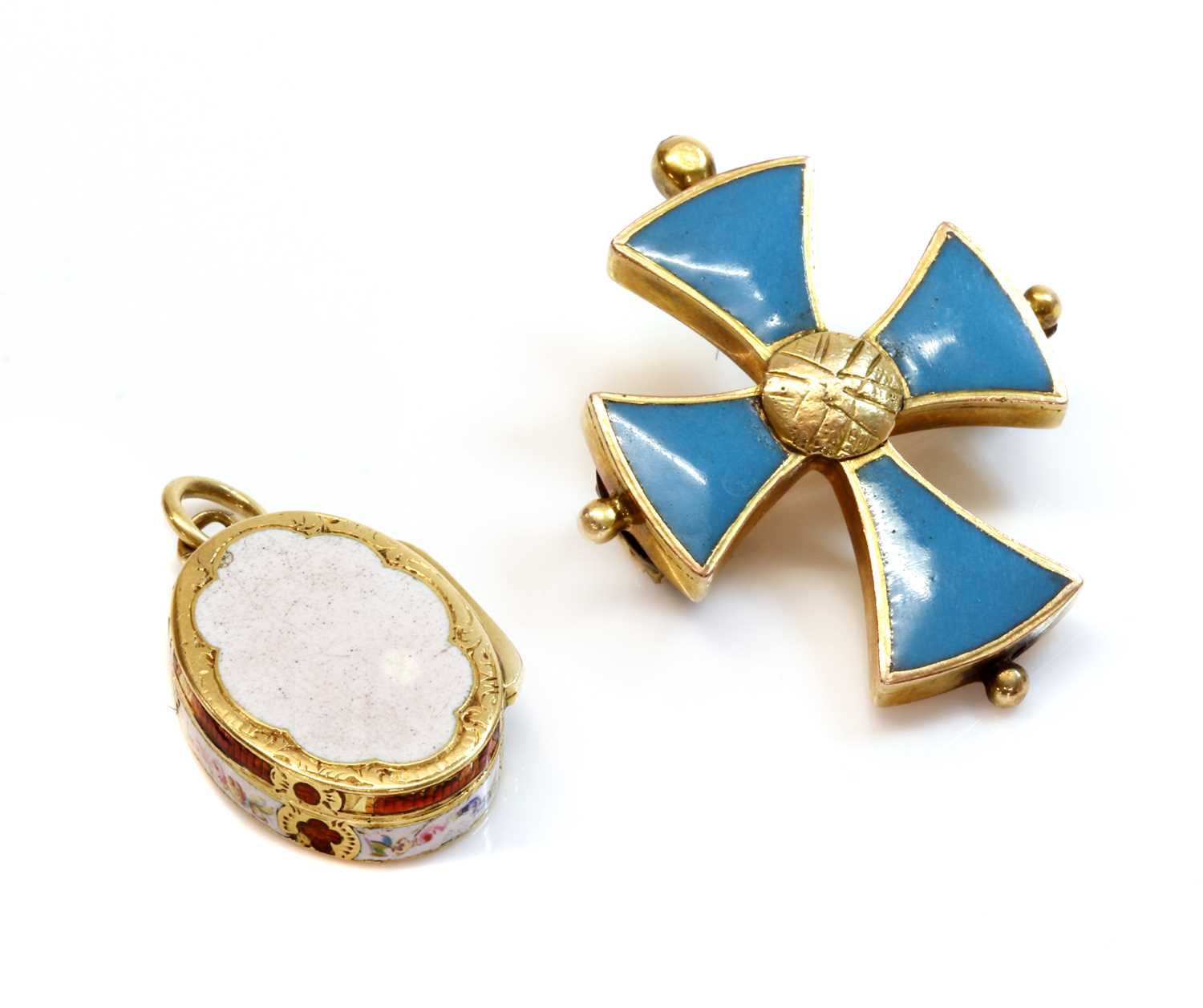 Lot 25 - A miniature gold oval locket form vinaigrette