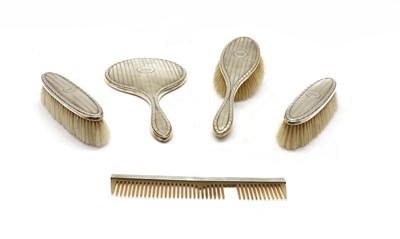 Lot 45 - A four piece silver dressing set