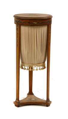 Lot 414 - An Edwardian circular painted satinwood worktable
