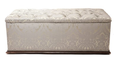Lot 594 - A silk-upholstered ottoman