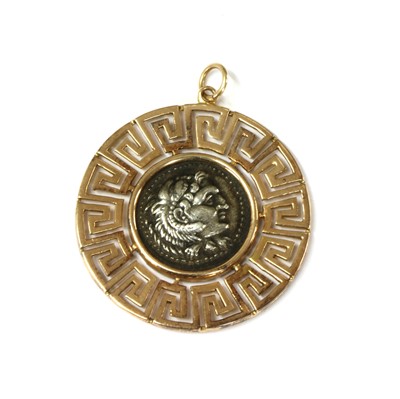 Lot 87 - A gold and silver pendant