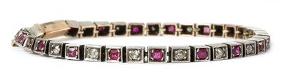 Lot 7 - A French silver and gold, ruby and diamond line bracelet