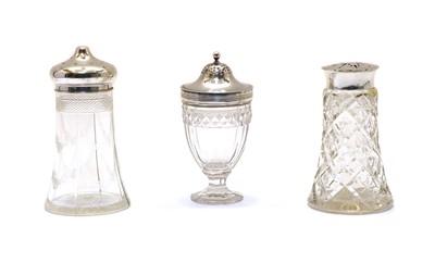 Lot 8 - Three various glass and silver topped casters