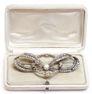Lot 48 - A cased former Austro-Hungarian diamond set bow and hoop brooch, by Ernest Paltsho, Vienna, c.1900