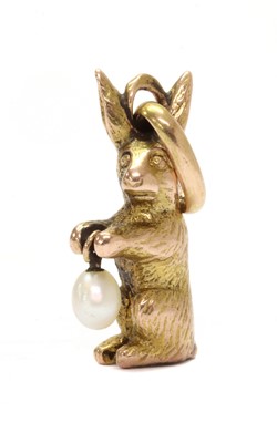 Lot 1367 - A Continental gold pearl charm