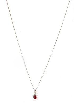 Lot 1219 - An 18ct white gold ruby and diamond pendant