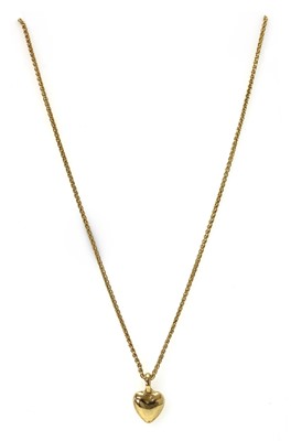 Lot 1128 - A 9ct gold heart shaped pendant