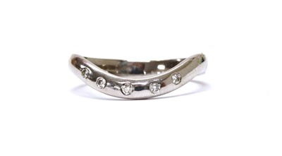 Lot 1208 - An 18ct white gold diamond set shaped band ring