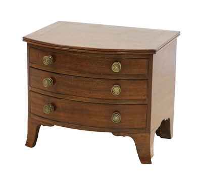 Lot 364 - A small mahogany bowfront chest of three drawers