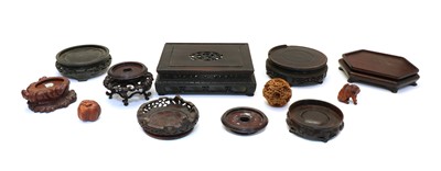 Lot 117 - A collection of Chinese wood stands