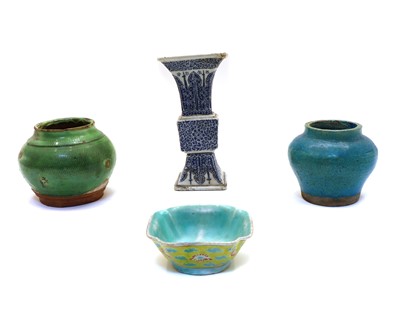 Lot 185 - A Chinese square of baluster shaped white vase with raised blue decoration