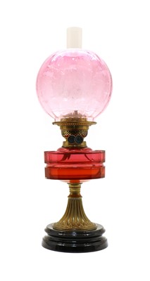 Lot 263 - A Victorian cranberry glass oil lamp