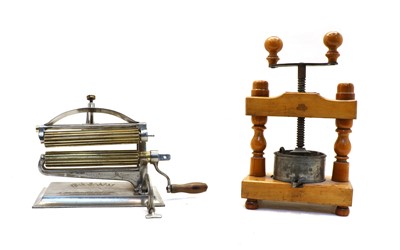 Lot 52 - An American 'Crown' pasta maker and a French wooden press