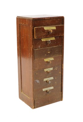 Lot 384 - A seven drawer pine workshop chest
