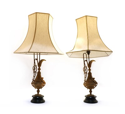 Lot 150 - A pair of Continental gilt metal table lamps