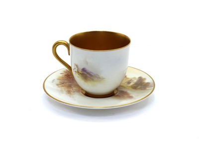 Lot 101 - A Royal Worcester porcelain cabinet cup and saucer